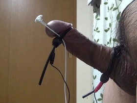 Japanese gay guy masturbates with electro stimulation and cums